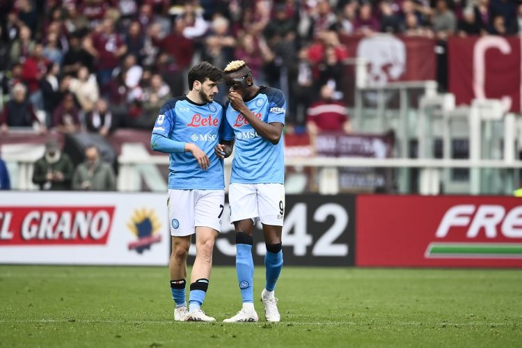 TURIN, ITALY - MARCH 19: (L-R) Khvicha Kvaratskhelia of SSC Napoli and Victor Osimhen of SSC Napoli speaks during the Serie A match between Torino FC and SSC Napoli at Stadio Olimpico di Torino on March 19, 2023 in Turin, Italy. (Photo by Stefano Guidi/Getty Images)