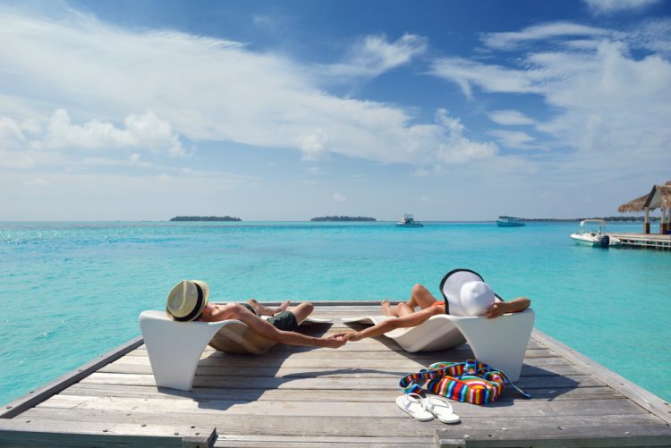 happy young romantic couple in love have fun running and relaxing on beautiful beach