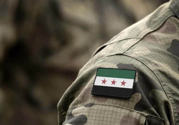 Flag of Syrian National Coalition on military uniform (collage).